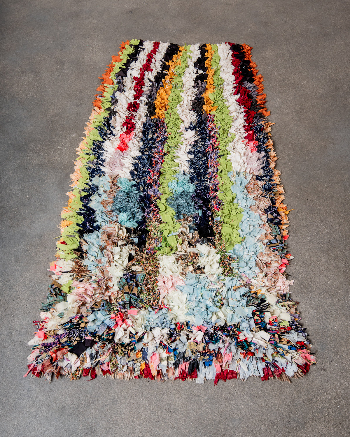 Modern designer vintage handcrafted Berber rug from Morocco. Boucherouite runner rug with beautiful colors and patterns.